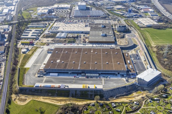 Aerial view, construction site new building Amazon logistics centre, industrial estate on Brauckstraße, Ostermann Einrichtungs-Centrum, Bauhaus Baumarkt, allotment garden site Mellmausland, Rüdinghausen, Witten, Ruhr area, North Rhine-Westphalia, Germany, Amazon logistics centre, railway tracks, construction work, construction area, construction site, building plots, construction measure, construction project, construction site, DE, Ennepe-Ruhr district, development, Europe, community garden, commercial enterprises, commercial premises, commercial area, commercial park, commercial site, commercial use, freight traffic, industrial estate, industrial building, industrial site, allotment garden, allotment garden site, allotment garden association, allotment garden association, logistics, logistics service, logistics service provider, logistics provider, logistics centre, aerial view, aerial photography, aerial photography, Menglinghauser Straße, furniture store, new build, parcel delivery...