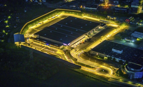 Aerial photo, Amazon logistics centre, Brauckstraße industrial estate, Rüdinghausen, Witten, Ruhr area, North Rhine-Westphalia, Germany, DE, twilight photography, Europe, commercial enterprises, commercial area, commercial location, commercial use, freight traffic, industrial area, industrial building, industrial site, light pollution, logistics, logistics service, logistics service provider, logistics provider, logistics centre, aerial view, aerial photography, aerial photography, night, night shot, night flight, transport service, overview, bird's-eye view, illuminated streets, birds-eyes view, nightflight, overview