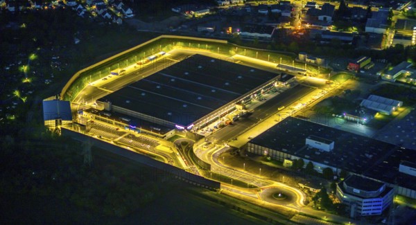 Aerial photo, Amazon logistics centre, Brauckstraße industrial estate, Rüdinghausen, Witten, Ruhr area, North Rhine-Westphalia, Germany, DE, twilight photography, Europe, commercial enterprises, commercial area, commercial location, commercial use, freight traffic, industrial area, industrial building, industrial site, light pollution, logistics, logistics service, logistics service provider, logistics provider, logistics centre, aerial view, aerial photography, aerial photography, night, night shot, night flight, transport service, overview, bird's-eye view, illuminated streets, birds-eyes view, nightflight, overview