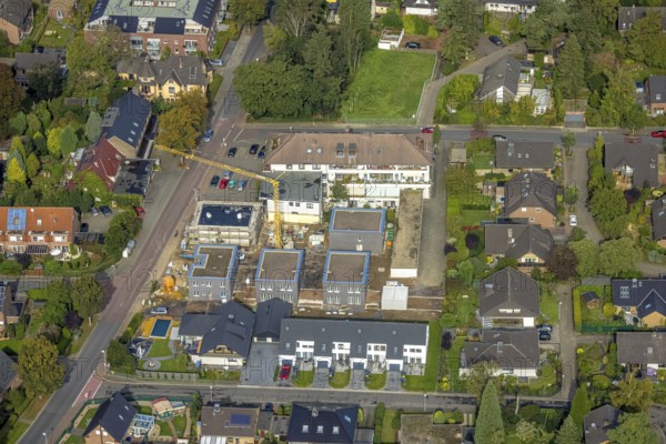 Aerial view, construction site with new construction of residential buildings on the site of the former Haus Blumenkamp restaurant in the Blumenkamp district of Wesel, Lower Rhine, North Rhine-Westphalia, Germany, construction work, construction area, construction site, building plots, construction crane, construction project, construction site, DE, Europe, property tax, real estate, aerial view, aerial photography, aerial photography, new building, overview, bird's-eye view, Wesel, housing estate, living and living, residential area, residential buildings, residential quality, residential neighbourhood, housing estate, birds-eyes view, overview