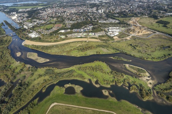 Aerial view, renaturalisation of the Lippe estuary area between Lippeschlösschen and Rhine bridge and Rhine river as well as Rhine-Lippe harbour and construction site of the southern bypass in Wesel, Lower Rhine, North Rhine-Westphalia, Germany, construction work, construction area, construction site, building plots, construction project, construction project, construction site, DE, Europe, Lippe floodplain, Lippeverband, aerial view, aerial photography, aerial photography, new construction, overview, redesign of the Lippe estuary, bird's-eye view, Wesel, birds-eyes view, overview, B58 new, Wesel southern bypass, new road construction, new Lippe estuary