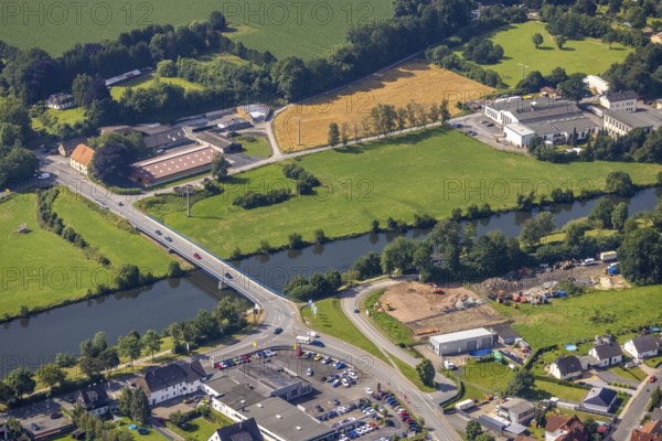 Aerial view, Ruhr bridge federal road 63 over the river Ruhr, construction site on the banks of the Ruhr, Wickede, Sauerland, North Rhine-Westphalia, Germany, construction area, construction site, building plots, construction site, bridge, DE, Europe, aerial view, aerial photography, aerial photography, Ruhr bridge, road traffic, overview, traffic volume, bird's eye view, birds-eyes view, overview