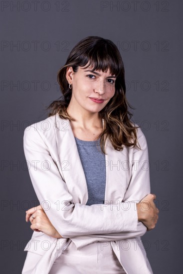 Elegant professional businesswoman with her arms crossed