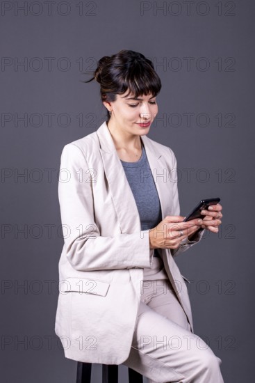 Elegant professional businesswoman checking her phone
