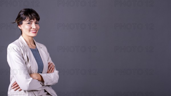 Elegant professional businesswoman with her arms crossed