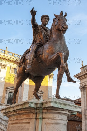 Bronze replica of historical equestrian statue of Roman Emperor Marcus Aurelius Antoninus Augustus with right arm raised in Roman salute, Piazza di Campidoglio, Rome, Lazio, Italy