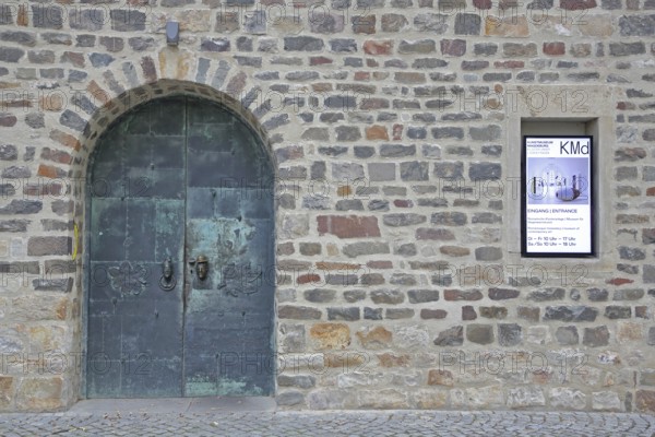 Door and entrance to the art museum, metal door, banner, stone wall, art museum, Kloster Unser Lieben Frauen, Magdeburg, Romanesque Road, Saxony-Anhalt, Germany