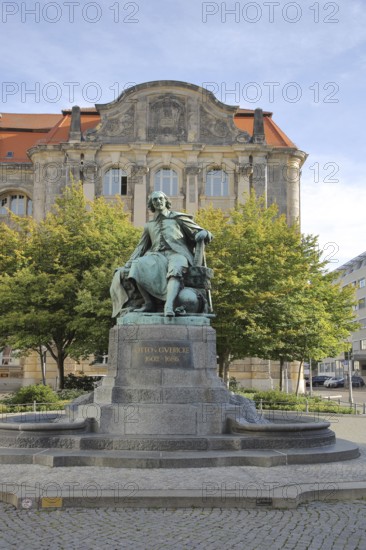 Otto von Guericke Fountain and monument to physicist Otto von Guericke, inscription, sculpture, New Town Hall, view from below, Hauptwache, Magdeburg, Saxony-Anhalt, Germany