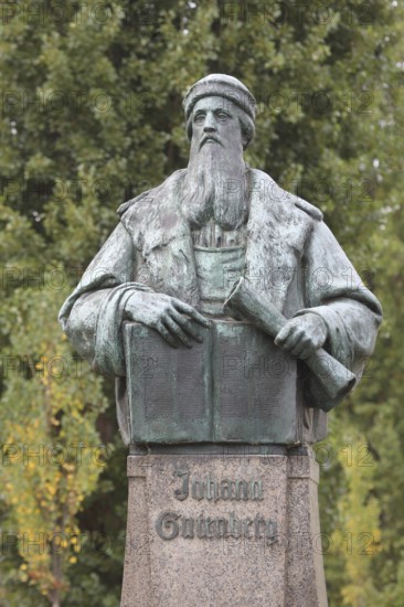 Monument to Johannes Gutenberg with book, scroll, inscription, bronze sculpture, Gutenberg monument, Magdeburg, Saxony-Anhalt, Germany