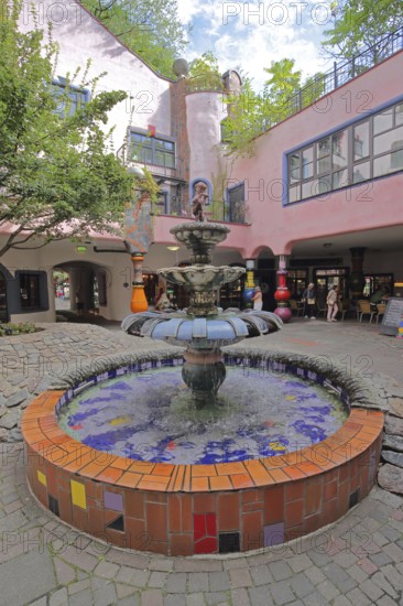 Fountain in the inner courtyard, Green Citadel, Hundertwasser House, mosaic, Magdeburg, Saxony-Anhalt, Germany