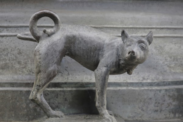 Detail with dog figure urinating at the Faun Fountain by Heinrich Apel 1986, holding one leg up, modern art, bronze sculpture, urinating, Devil's Fountain, Magdeburg, Saxony-Anhalt, Germany