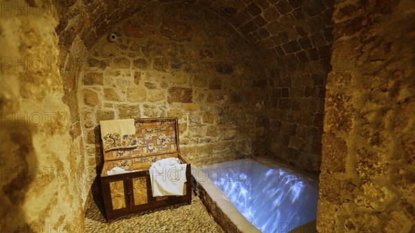 A stone room with an illuminated immersion bath for ritual purification, Kahal Shalom Synagogue, Sephardic Synagogue, Oldest Synagogue in Greece, Synagogue, Jewish Quarter, Rhodes Old Town, Rhodes Town, Rhodes, Dodecanese, Greek Islands, Greece