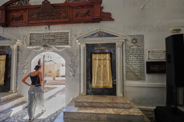 A woman enters a synagogue through a decorative arch, Kahal Shalom Synagogue, Sephardic Synagogue, Oldest Synagogue in Greece, Synagogue, Jewish Quarter, Rhodes Old Town, Rhodes Town, Rhodes, Dodecanese, Greek Islands, Greece