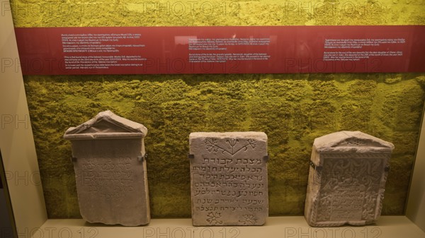 Three ancient Hebrew tombstones in an exhibition with yellow background, Kahal Shalom Synagogue, Sephardic Synagogue, Oldest Synagogue in Greece, Synagogue, Jewish Quarter, Rhodes Old Town, Rhodes Town, Rhodes, Dodecanese, Greek Islands, Greece