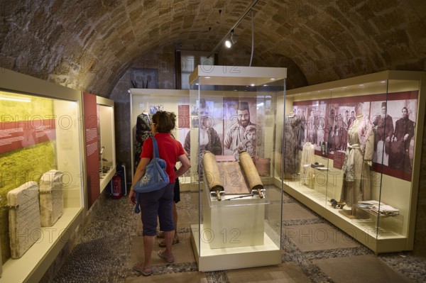 Museum exhibition with manuscripts and visitors in historic vaults, Kahal Shalom Synagogue, Sephardic Synagogue, Oldest Synagogue in Greece, Synagogue, Jewish Quarter, Rhodes Old Town, Rhodes Town, Rhodes, Dodecanese, Greek Islands, Greece