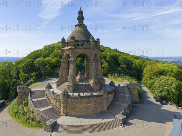 An imposing building surrounded by forests under a blue sky, aerial view, Kaiser Wilhelm Monument at Porta Westfalica, Barkhausen, East Westphalia-Lippe, North Rhine-Westphalia, Germany