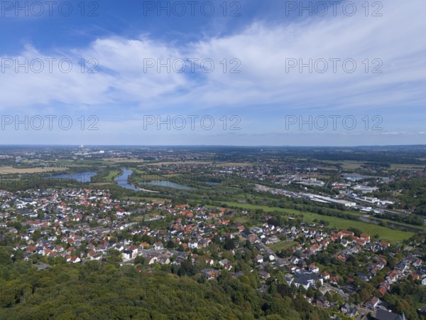 View of a town with river and green landscape under a blue sky with clouds, aerial view from the Kaiser Wilhelm monument at Porta Westfalica, Barkhausen, East Westphalia-Lippe, North Rhine-Westphalia, Germany