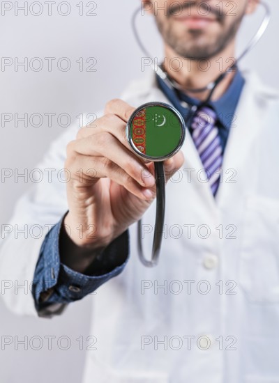 Turkmenistan health and medical insurance concept. Turkmenistan healthcare system, doctor holding stethoscope