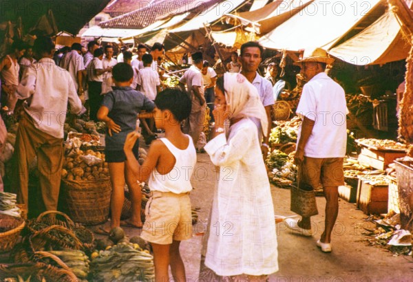People shopping at vegetable stalls at the old market, Johor Bahru, Johor, Malaya, Malaysia, south east Asia 1963