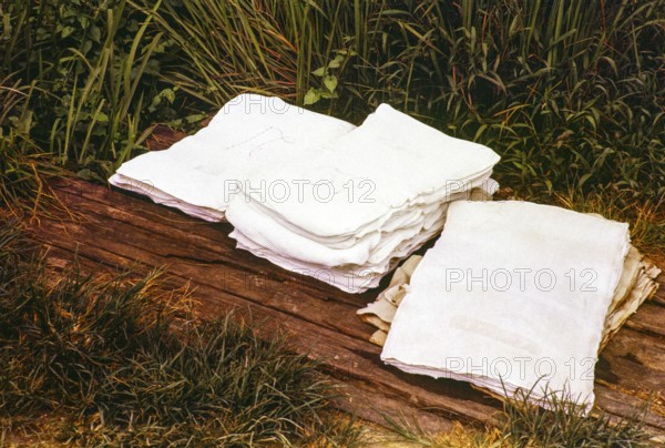 Unsmoked sheets of rubber piled up on roadside, Pahang, Malaya, Malaysia, south east Asia 1963