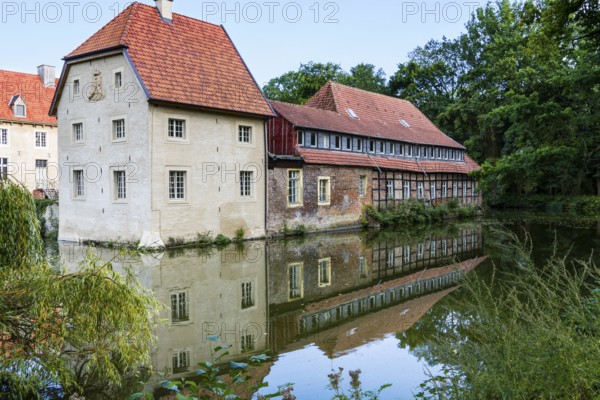 Water reflection, Senden Castle, Senden, North Rhine-Westphalia, Germany