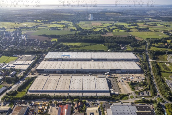 Large area with warehouses in the middle of a rural landscape under a sunny sky, aerial view Werl overview, Amazon distribution centre Werne, Werne, North Rhine-Westphalia, Germany