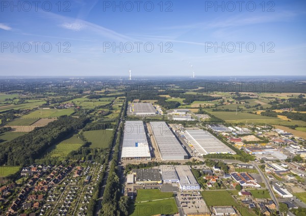 Industrial area with large factory buildings, surrounded by fields and forest under a blue sky, aerial view Werl overview, Amazon distribution centre Werne, Werne, North Rhine-Westphalia, Germany