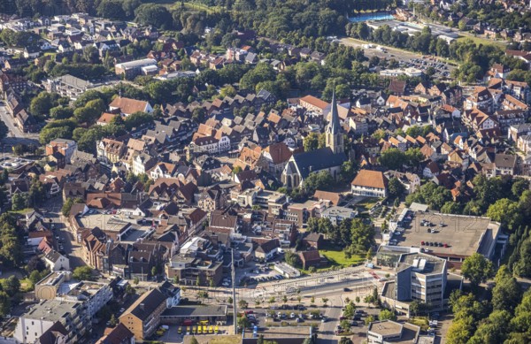 Close-up of the town centre with a prominent church surrounded by houses and green areas, aerial view Werl overview, Amazon distribution centre Werne, Werne, North Rhine-Westphalia, Germany