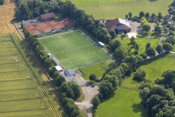 Aerial view, sports ground DJK - Blau Weiß Büderich, Kuniberthalle Büderich Schützenhalle with solar roof, Westbüderich, Werl, Soester Börde, North Rhine-Westphalia, Germany, DE, Europe, football pitch, football stadium, aerial view, aerial photography, aerial photography, photovoltaics, photovoltaic system, shooting hall, solar, solar system, solar roof, solar energy, solar energy, sports, sports facilities, sports field, sports facility, tennis, tennis facility, tennis courts, overview, venue, event location, bird's-eye view, birds-eyes view, overview