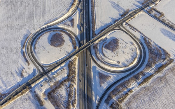 Aerial view, motorway junction AS55 Werl-Süd on the motorway A44, federal road B516 Neheimer Straße, car park Werl-Süd, winter, snow, Werl, Soester Börde, North Rhine-Westphalia, Germany, Soester, Börde, DE, Europe, birds-eyes, view, aerial photography, aerial photography, aerial photography, overview, overview, bird's eye view, A44, motorway junction, AS55, B516, transport, traffic, infrastructure, logistics, road traffic, snow