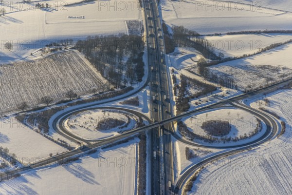 Aerial view, motorway junction AS55 Werl-Süd on the motorway A44, federal road B516 Neheimer Straße, car park Werl-Süd, winter, snow, Werl, Soester Börde, North Rhine-Westphalia, Germany, Soester, Börde, DE, Europe, birds-eyes, view, aerial photography, aerial photography, aerial photography, overview, overview, bird's eye view, A44, motorway junction, AS55, B516, transport, traffic, infrastructure, logistics, road traffic, snow