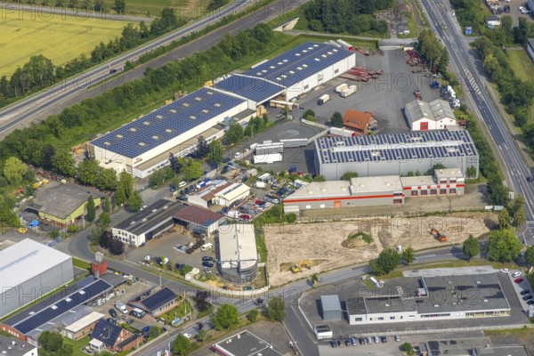 Aerial view, commercial area Hammer Straße, HolzTec GmbH with solar roof, Budberg, Werl, Soester Börde, North Rhine-Westphalia, Germany, DE, Europe, commercial enterprises, commercial area, commercial park, commercial location, commercial use, industrial area, industrial building, industrial location, aerial photograph, aerial photography, aerial photography, photovoltaic, photovoltaic system, solar, solar system, solar roof, solar energy, solar energy, overview, bird's eye view, birds-eyes view, overview
