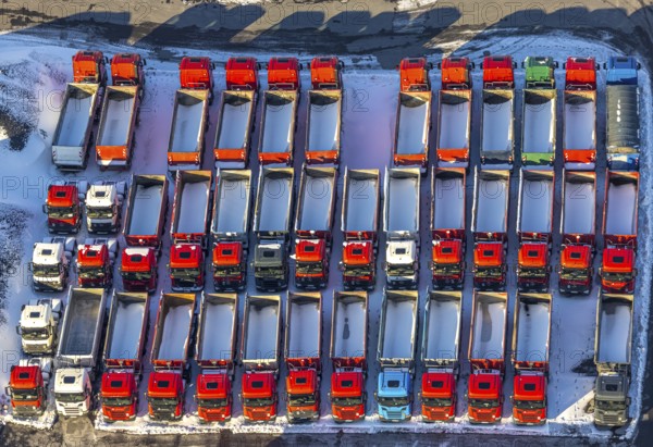 Aerial view, industrial estate KonWerl, winter, snow, Mimberg Spedition-Baustoffe GmbH & Co. KG, red lorry with loading area, Werl, Soester Börde, North Rhine-Westphalia, Germany, Soester, Börde, DE, Europe, birds-eyes, view, aerial view, aerial photography, aerial photography, overview, overview, bird's eye view, KonWerl, industry, trade, economy, commercial enterprise, production, trade