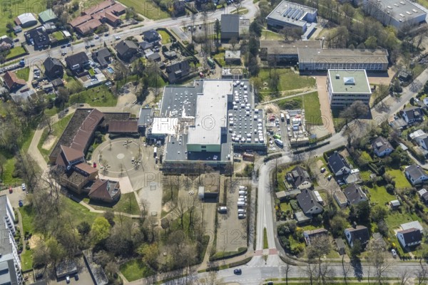 Aerial view, construction site roof renovation and remodelling of the Comenius comprehensive school, Voerde, Ruhr area, Lower Rhine, North Rhine-Westphalia, Germany, construction work, construction project, construction site, DE, Europe, aerial view, aerial photography, aerial photography, renovation, refurbishment, overview, bird's-eye view, overview