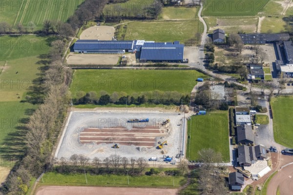 Aerial view, construction site for new sports field, sports centre Voerde, Rönskenstraße, Reiterverein Voerde, Erich Kästner-Schule, Voerde, Ruhr area, Lower Rhine, North Rhine-Westphalia, Germany, construction work, construction area, building site, building plots, construction project, construction site, DE, Europe, aerial view, aerial photography, aerial photography, photovoltaics, photovoltaic system, solar, solar system, solar energy, solar energy, overview, bird's eye view, bird's eye view, overview