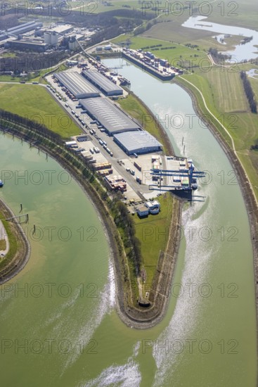 Aerial view, harbour Emmelsum, lock road, river Rhine, Rhine estuary Wesel-Datteln canal, Emmelsum, Voerde, Ruhr area, Lower Rhine, North Rhine-Westphalia, Germany, inland navigation, view to Büderich, DE, Europe, distant view, river, goods transport, goods traffic, harbour basin, canal, logistics, aerial view, aerial photography, aerial photography, estuary, ship, shipping pier, shipping traffic, lock, overview, bird's eye view, bird's eye view, overview