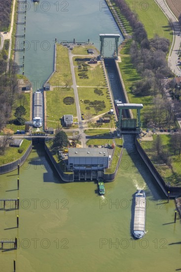 Aerial view, harbour Emmelsum, lock Friedrichsfeld, lock road, river Rhine, Rhine estuary Wesel-Datteln canal, Emmelsum, Voerde, Ruhr area, Lower Rhine, North Rhine-Westphalia, Germany, inland navigation, view to Büderich, DE, Europe, distant view, river, goods transport, goods traffic, harbour basin, canal, logistics, aerial view, aerial photography, aerial photography, estuary, ship, shipping pier, shipping traffic, lock, overview, bird's eye view, birds-eyes view, overview