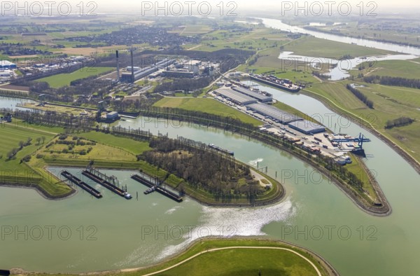 Aerial view, harbour Emmelsum, lock Friedrichsfeld, lock road, river Rhine, Rhine estuary Wesel-Datteln canal, Emmelsum, Voerde, Ruhr area, Lower Rhine, North Rhine-Westphalia, Germany, inland navigation, view to Büderich, DE, Europe, distant view, river, goods transport, goods traffic, harbour basin, canal, logistics, aerial view, aerial photography, aerial photography, estuary, ship, shipping pier, shipping traffic, lock, overview, bird's eye view, birds-eyes view, overview