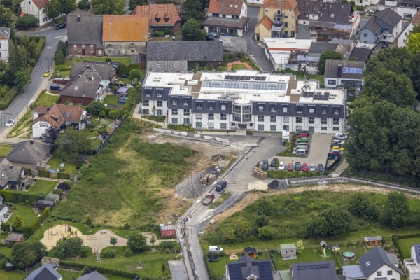 Aerial view, construction site at the nursing home complex Haus am Hellweg, Hemmerde, Unna, Ruhr area, North Rhine-Westphalia, Germany, retirement home, old people's home, construction work, construction area, construction site, construction project, construction site, care and nursing, DE, Europe, Große-Oetringhaus-Straße, aerial view, aerial photography, aerial photography, care facility, retirement home, retirement home, senior citizens' residence, senior citizens' centre, overview, bird's eye view, birds-eyes view, overview