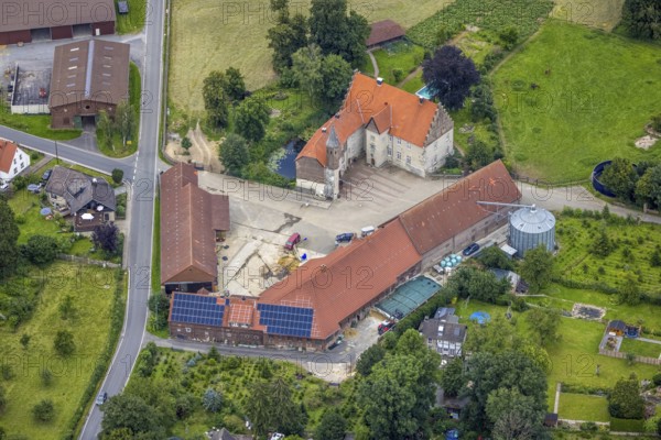 Aerial view, architectural monument, Haus Westhemmerde, farm, Westhemmerde, Unna, Ruhr area, North Rhine-Westphalia, Germany, architectural monument, DE, monument protection, Europe, manorial building, farm, aerial view, aerial photography, aerial photography, photovoltaic, photovoltaic system, castle, solar, solar system, solar roof, solar energy, solar energy, overview, bird's eye view, moat, moated castle, moated castle, birds-eyes view, former aristocratic residence, overview