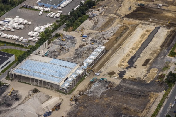 Aerial view, construction site and new building on Otto-cock-Straße in Unna Industrial Park, Unna, Ruhr area, North Rhine-Westphalia, Germany, construction work, construction area, construction site, building plots, construction project, construction site, DE, Europe, commercial enterprises, commercial area, commercial park, commercial site, commercial use, industrial area, industrial building, industrial site, aerial photograph, aerial photography, aerial photography, new building, overview, bird's eye view, birds-eyes view, overview