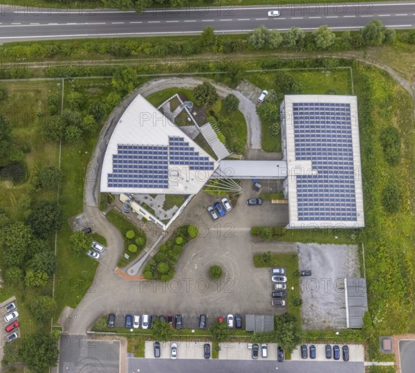 Aerial view, company building PVS / Westfalen-Süd rkV medical billing, Ülzen, Unna, Ruhr area, North Rhine-Westphalia, Germany, DE, Europe, shapes and colours, commercial enterprises, commercial area, commercial park, commercial location, commercial use, industrial area, industrial location, aerial view, aerial photography, aerial photography, photovoltaics, photovoltaic system, solar, solar system, solar roof, solar energy, solar energy, overview, bird's eye view, birds-eyes view, overview