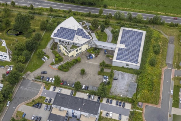 Aerial view, company building PVS / Westfalen-Süd rkV medical billing, Ülzen, Unna, Ruhr area, North Rhine-Westphalia, Germany, DE, Europe, shapes and colours, commercial enterprises, commercial area, commercial park, commercial location, commercial use, industrial area, industrial location, aerial view, aerial photography, aerial photography, photovoltaics, photovoltaic system, solar, solar system, solar roof, solar energy, solar energy, overview, bird's eye view, birds-eyes view, overview