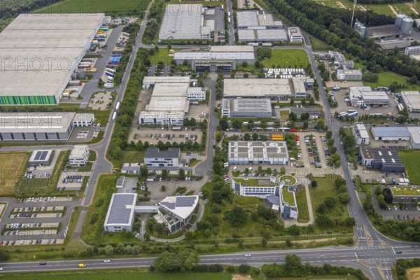 Aerial view, company building PVS / Westfalen-Süd rkV medical billing, Stadtwerke Unna, commercial area Physikerstraßen, Ülzen, Unna, Ruhr area, North Rhine-Westphalia, Germany, DE, Europe, shapes and colours, commercial enterprises, commercial area, commercial park, commercial location, commercial use, industrial area, industrial location, aerial view, aerial photography, aerial photography, photovoltaic, photovoltaic system, solar, solar system, solar roof, solar energy, solar energy, overview, bird's-eye view, birds-eyes view, overview