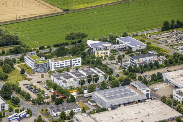 Aerial view, company building PVS / Westfalen-Süd rkV medical billing, Stadtwerke Unna, Ülzen, Unna, Ruhr area, North Rhine-Westphalia, Germany, DE, Europe, shapes and colours, commercial enterprises, commercial area, commercial park, commercial location, commercial use, industrial area, industrial site, aerial view, aerial photography, aerial photography, photovoltaic, photovoltaic plant, solar, solar plant, solar roof, solar energy, solar energy, overview, bird's-eye view, birds-eyes view, overview