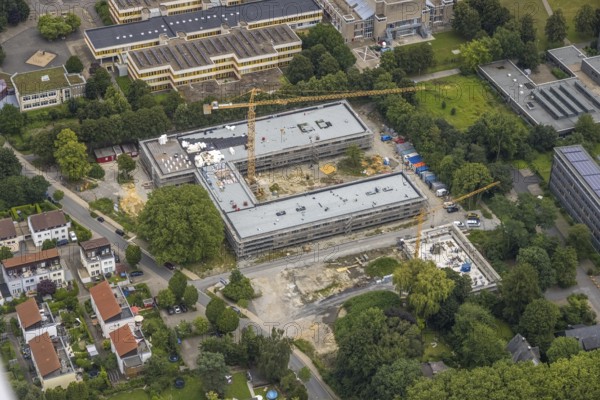 Aerial view, construction site and new building Bildungscampus Unna, new building kindergarten Rasselbande II Döbelner Straße, Königsborn, Unna, Ruhr area, North Rhine-Westphalia, Germany, construction work, construction area, construction site, building plots, construction crane, construction measure, construction project, construction site, education, campus, DE, Europe, kindergarten, day-care centre, day-care centre, day-care centre, aerial view, aerial photography, aerial photography, new building, overview, bird's-eye view, formerly Anne-Frank-Realschule, overview