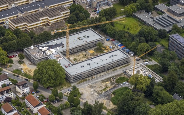 Aerial view, construction site and new building Bildungscampus Unna, new building kindergarten Rasselbande II Döbelner Straße, Königsborn, Unna, Ruhr area, North Rhine-Westphalia, Germany, construction work, construction area, construction site, building plots, construction crane, construction measure, construction project, construction site, education, campus, DE, Europe, kindergarten, day-care centre, day-care centre, day-care centre, aerial view, aerial photography, aerial photography, new building, overview, bird's-eye view, formerly Anne-Frank-Realschule, overview