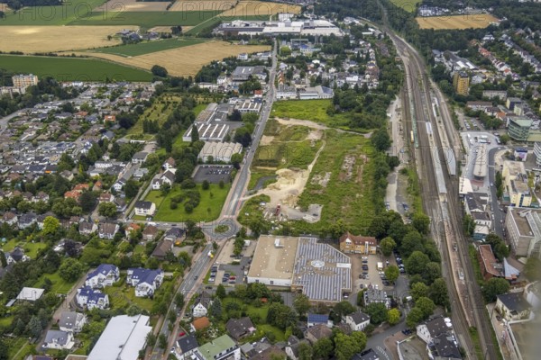 Aerial view, Unna railway station, Viktoriastrasse construction area for office building, Unna, Ruhr area, North Rhine-Westphalia, Germany, railway tracks, railway station, construction area, construction site, building plots, construction project, construction site, DE, Deutsche Bahn AG, Europe, central station, main station, aerial view, aerial photography, aerial photography, overview, bird's-eye view, bird's-eye view, overview