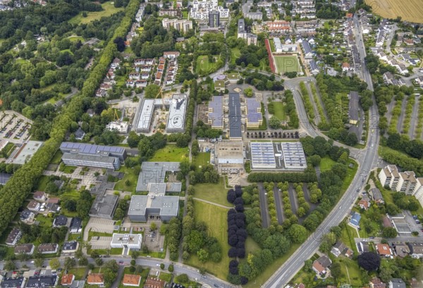 Aerial view, construction site and new building Bildungscampus Unna, school centre with Werner von Siemens comprehensive school, Geschwister-Scholl-Gymnasium Unna, Hellweg Berufskolleg Unna, Erich Göpfert civic hall Unna, new building kindergarten Rasselbande II Döbelner Straße, Königsborn, Unna, Ruhr area, North Rhine-Westphalia, Germany, construction work, construction area, construction site, building plots, construction crane, construction project, construction site, education, educational institution, campus, DE, Europe, grammar school, kindergarten, day care centre, day nursery, day care centre, teaching institute, aerial view, aerial photography, aerial photography, new building, school, school centre, overview, bird's-eye view, birds-eyes view, formerly Anne-Frank-Realschule, overview