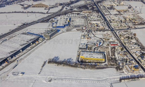 Aerial view, commercial area Unna-Kamen, central warehouse for Woolworth, ERL euro retail logistics GmbH, DHL, Ikea, Afferde, Unna, Ruhr area, North Rhine-Westphalia, Germany, DE, Europe, commercial enterprises, commercial area, commercial area, commercial location, commercial use, industrial area, industrial location, aerial view, aerial photography, aerial photography, Mönninghoffsfeld, snow, overview, bird's-eye view, winter, onset of winter, winter landscape, birds-eyes view, overview